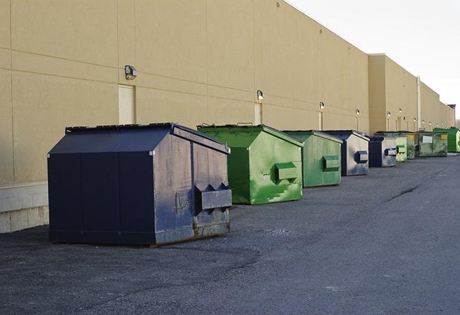 a crowd of dumpsters of all colors and sizes at a construction site in Eldorado, WI